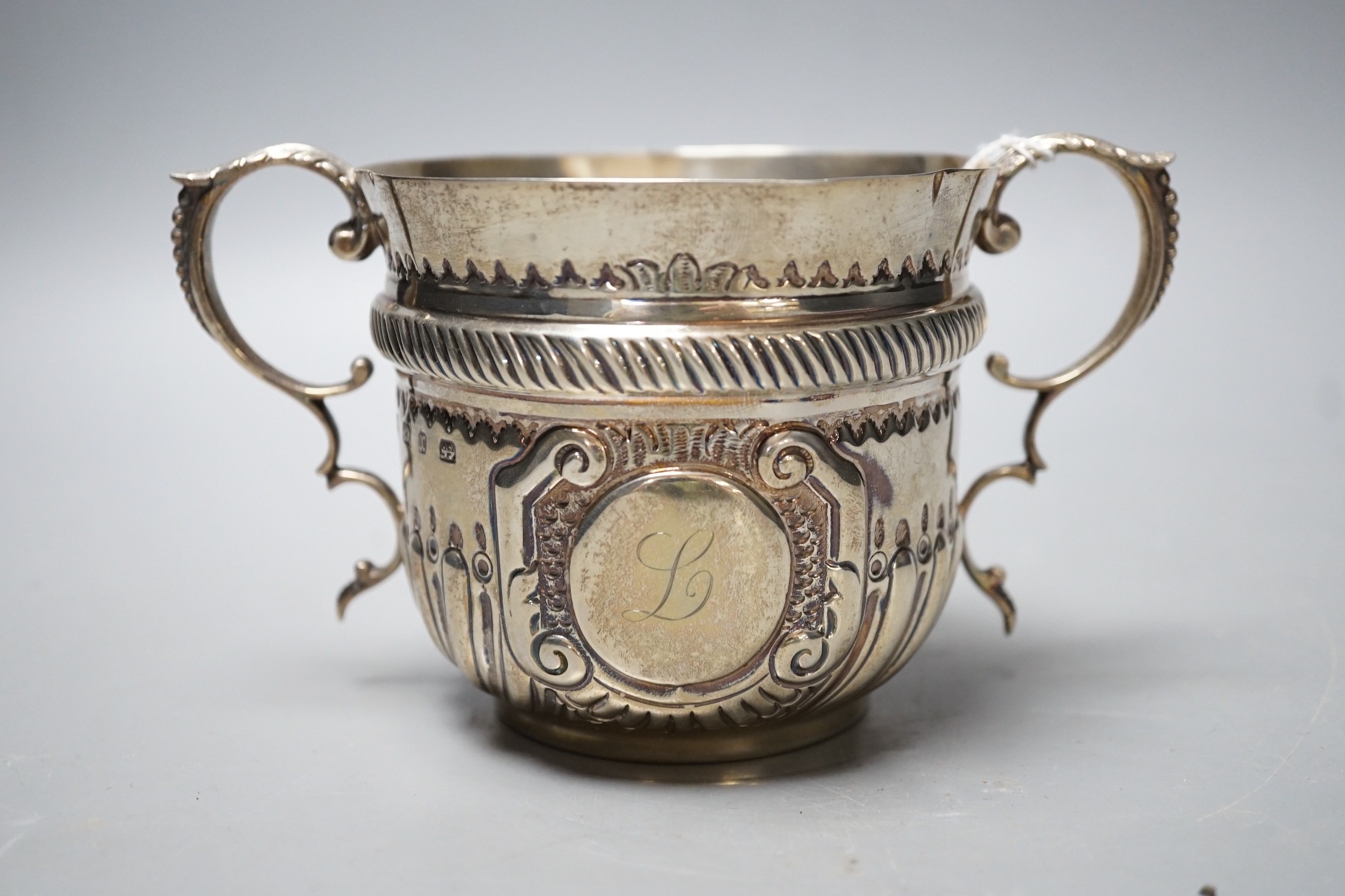 A late Victorian demi fluted silver porringer, by D & M Davis, Birmingham, 1897, height 92mm, 7oz.